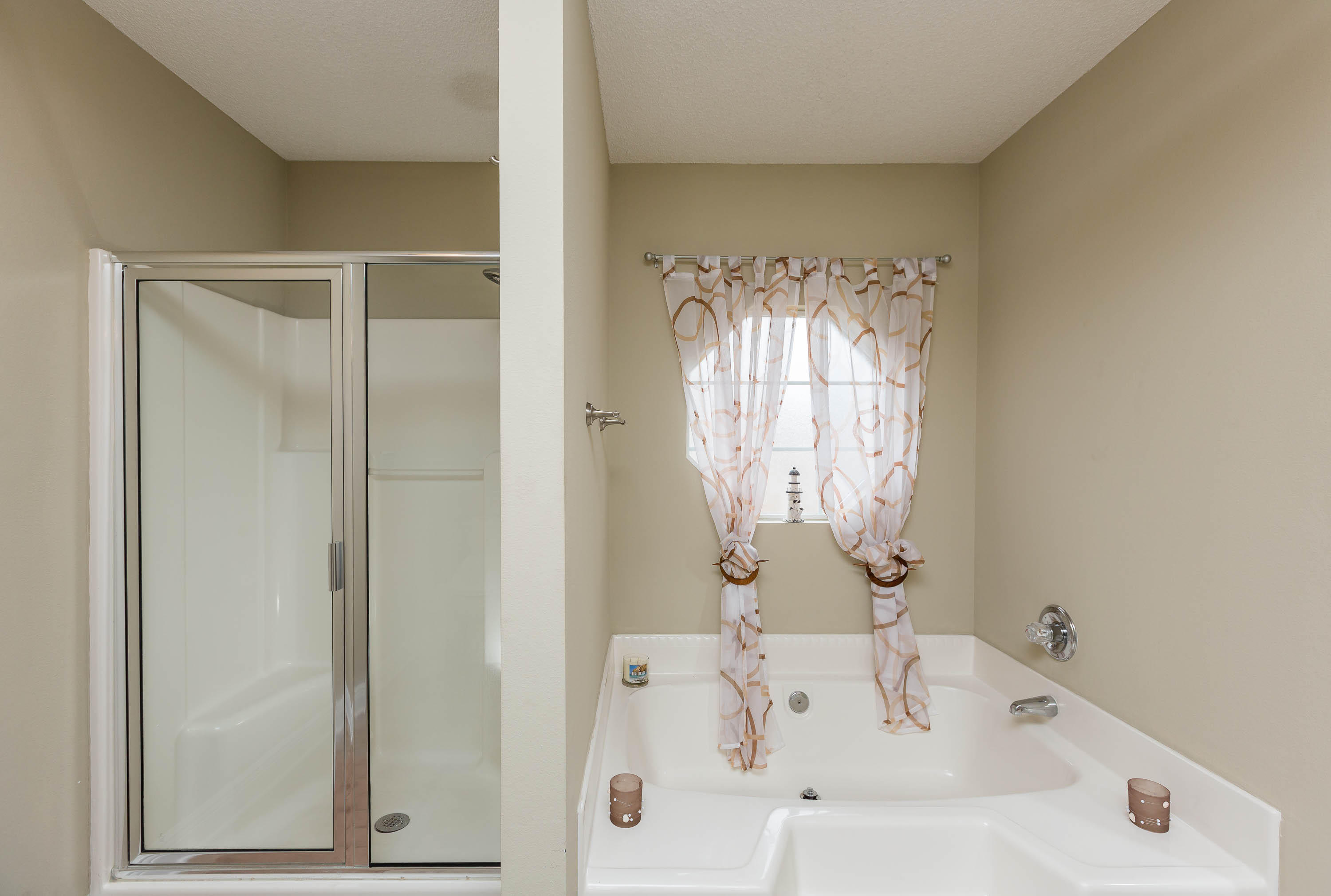 402 Swift Fox Run Crestview, FL 32536 - Photo 36 of 47 a bathroom with a tub and shower