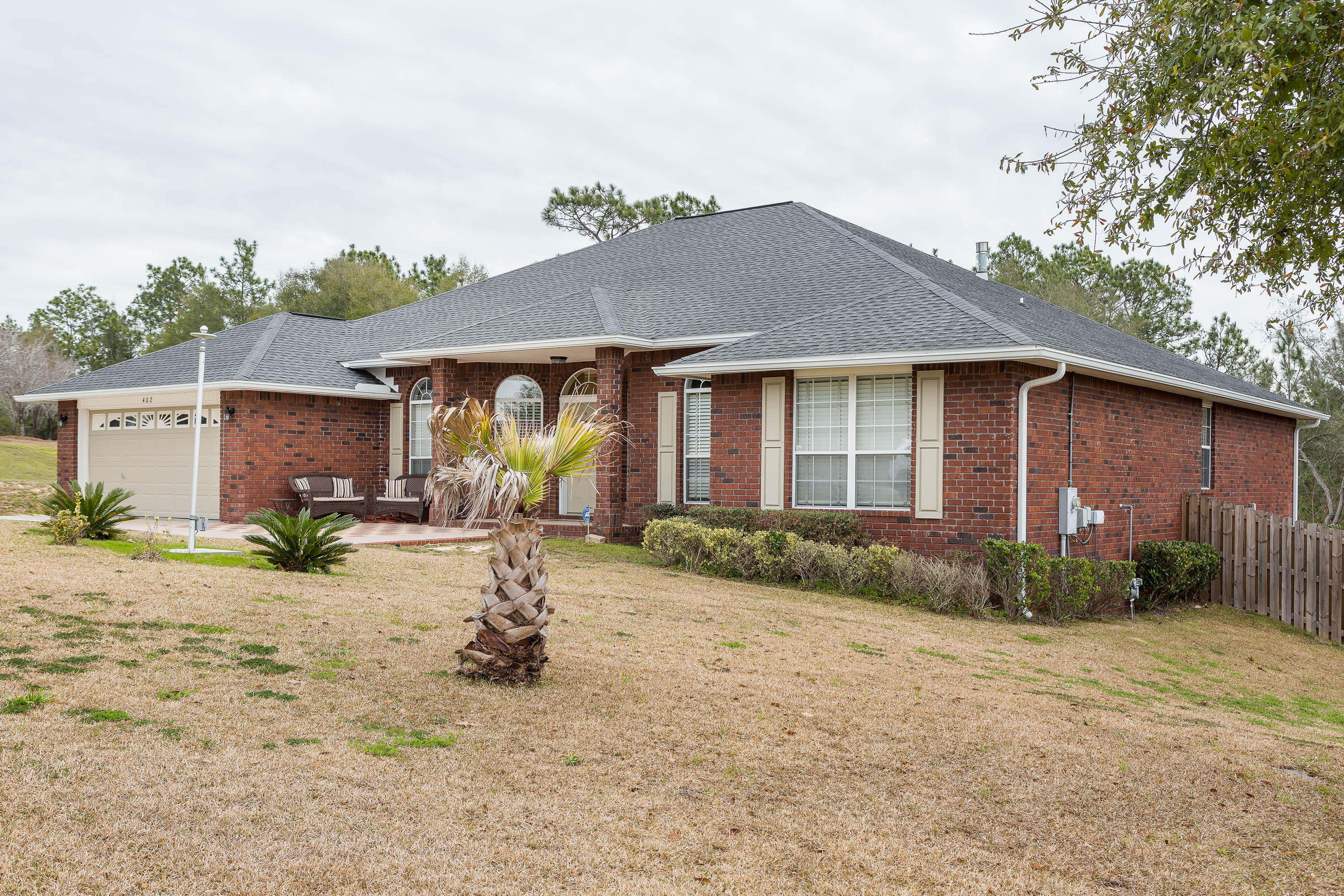 402 Swift Fox Run Crestview, FL 32536 - Photo 5 of 47 a view of a house with backyard and garden