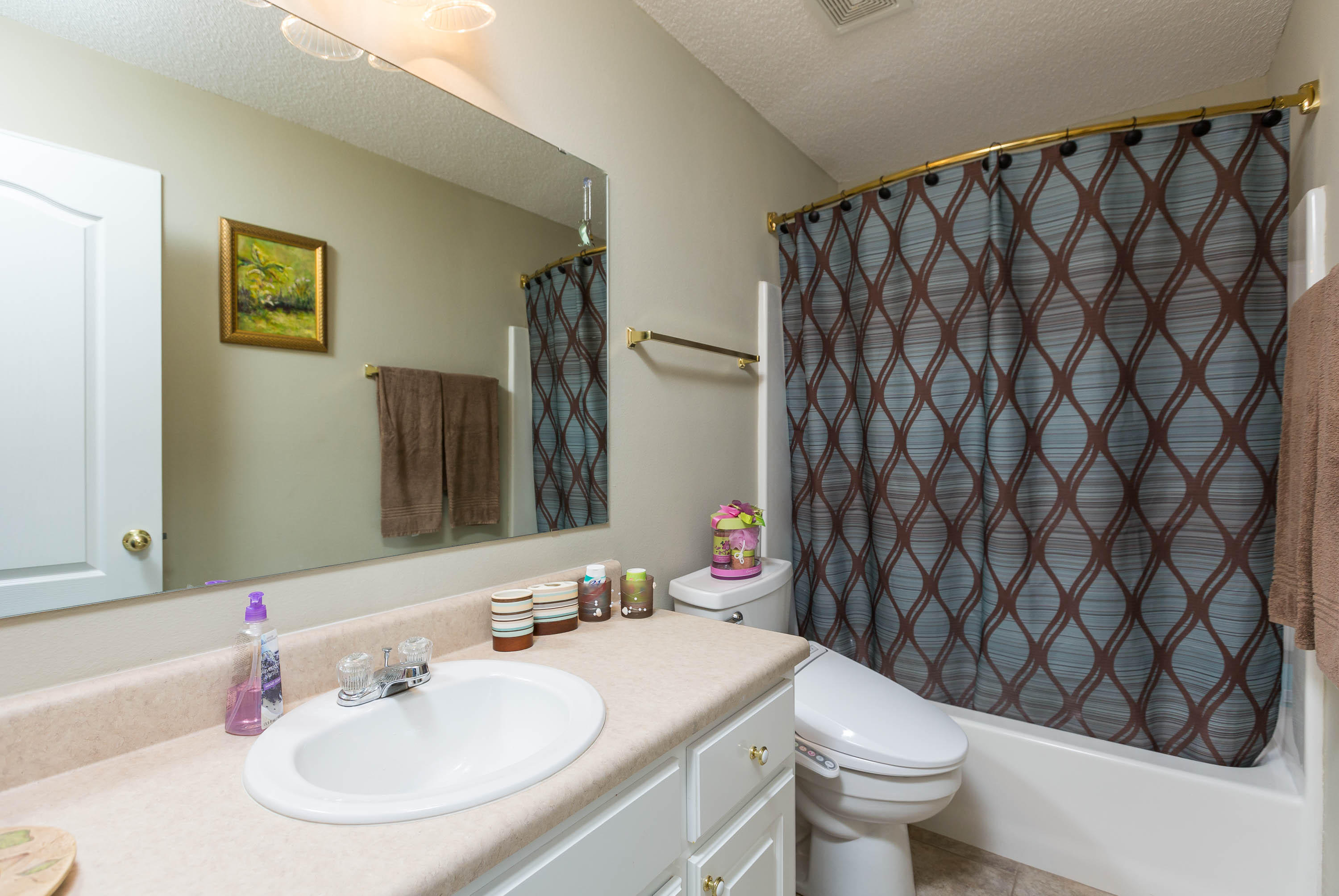 402 Swift Fox Run Crestview, FL 32536 - Photo 45 of 47 a bathroom with a sink toilet and a mirror
