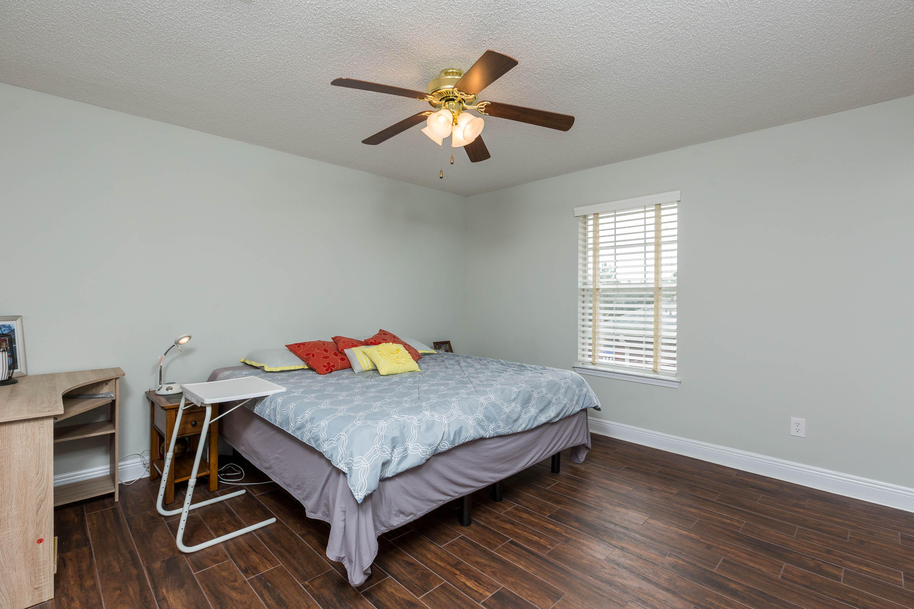 402 Swift Fox Run Crestview, FL 32536 - Photo 46 of 47 a bedroom with a bed and a chandelier