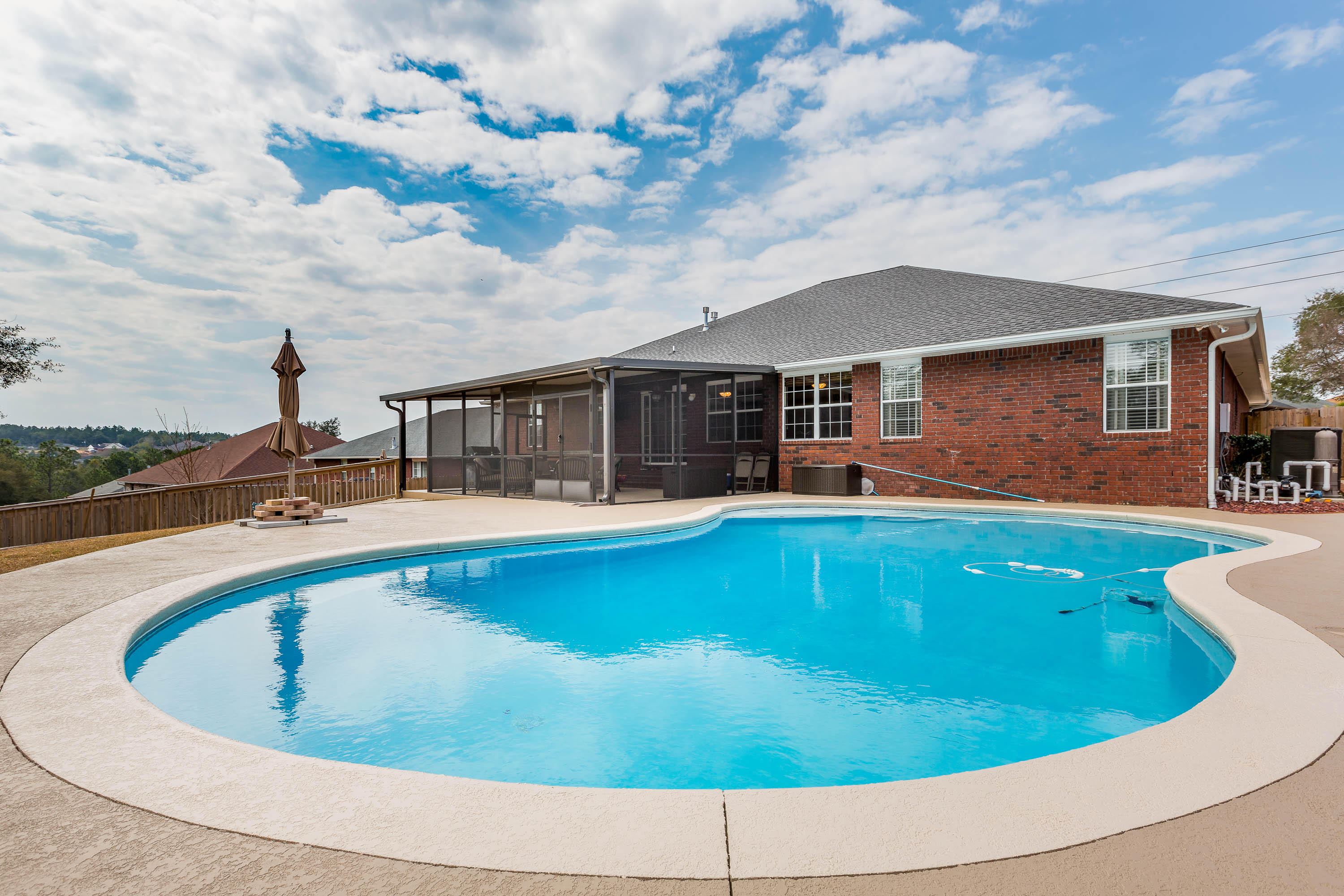 402 Swift Fox Run Crestview, FL 32536 - Photo 6 of 47 a swimming pool with outdoor seating and yard