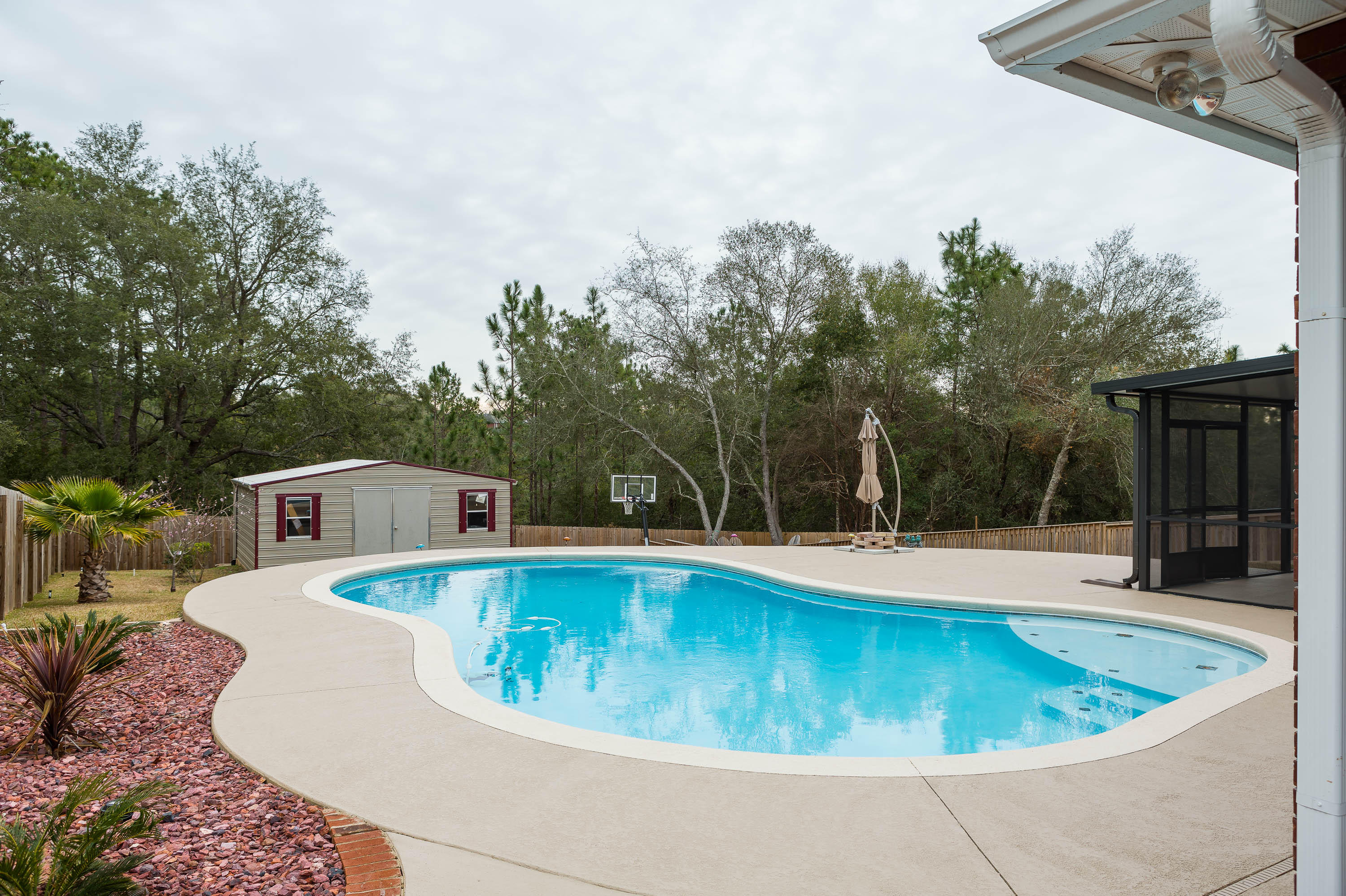 402 Swift Fox Run Crestview, FL 32536 - Photo 7 of 47 a view of a swimming pool with a yard