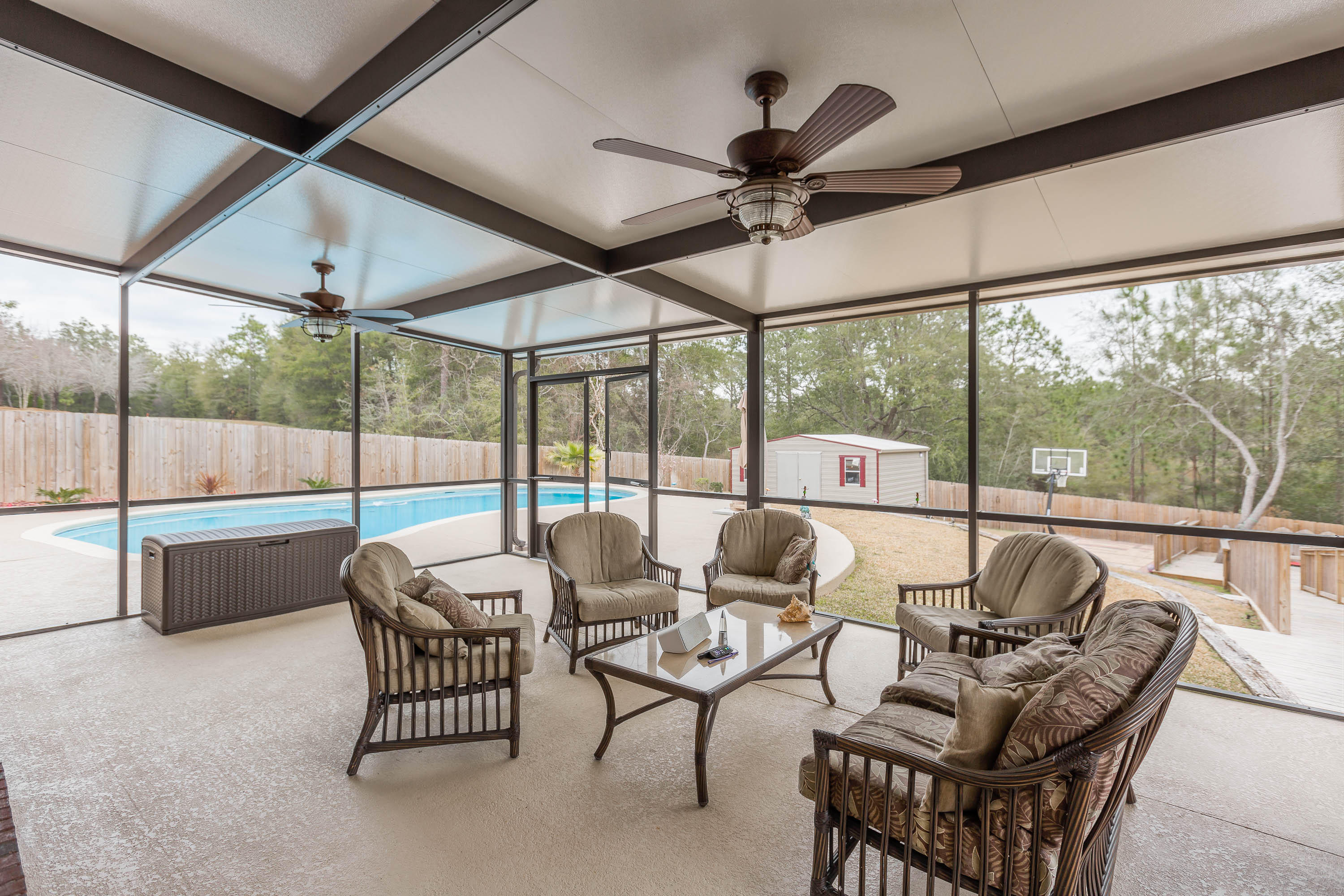 402 Swift Fox Run Crestview, FL 32536 - Photo 9 of 47 a living room with furniture and a large window