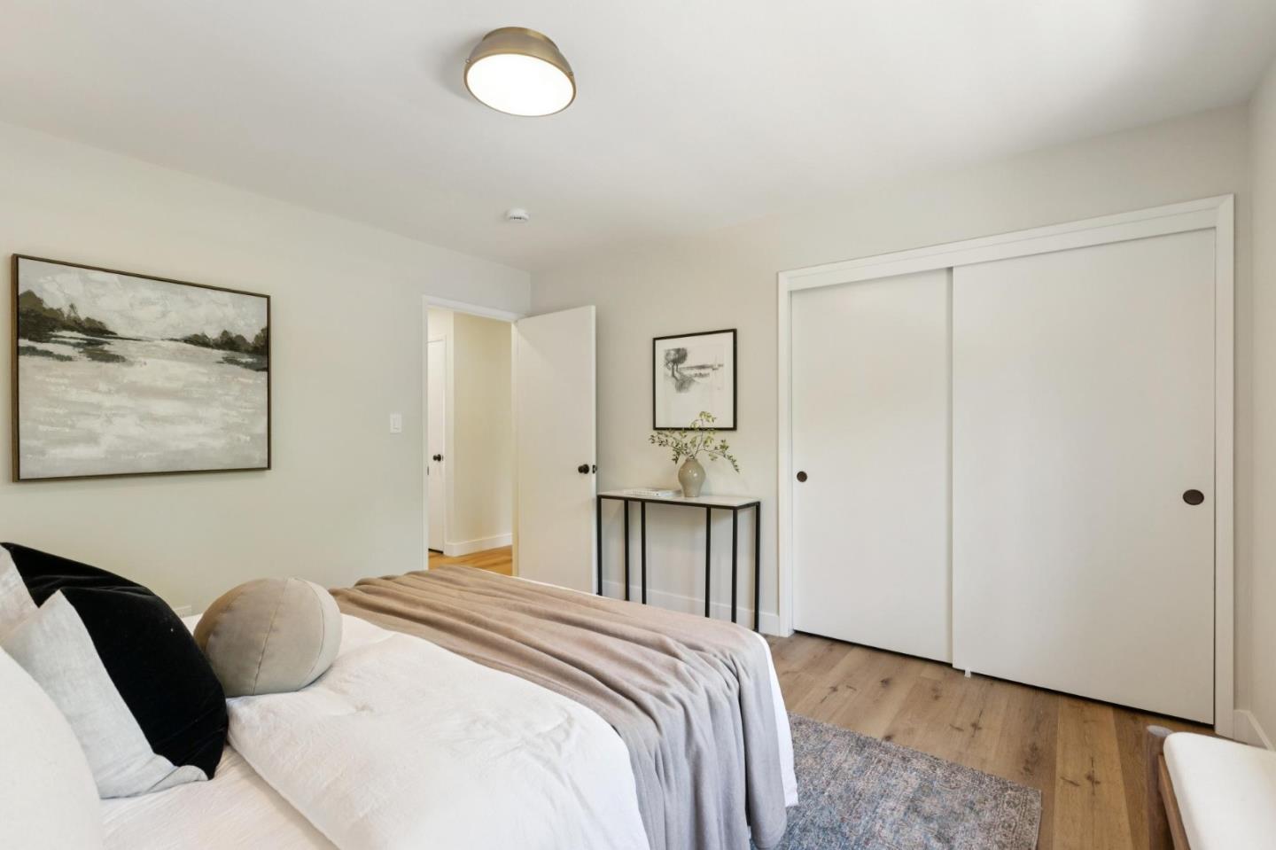 755 Santa Rita Avenue Los Altos, CA 94022 - Photo 36 of 50 a bedroom with a bed and a painting on the wall