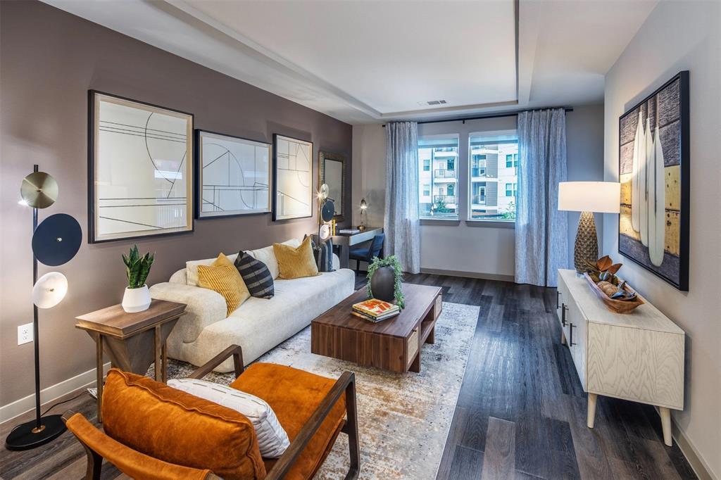 880 Lake Carolyn Parkway, Unit 319 Irving, TX 75039 - Photo 14 of 18 a living room with furniture a wooden floor and a window