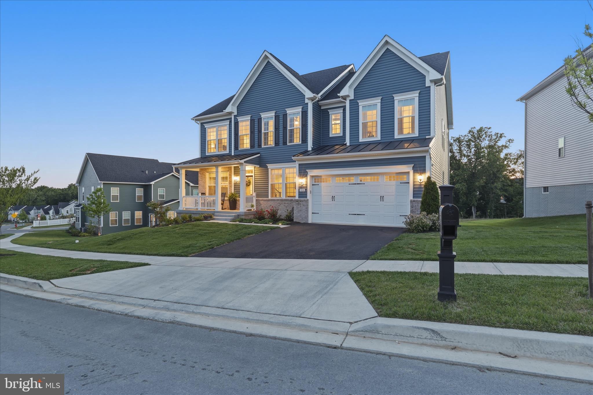 910 Enfield Farm Lane Brunswick, MD 21716 - Photo 62 of 87 a front view of a house with a yard and garage
