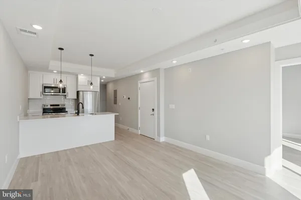 a view of kitchen with wooden floor