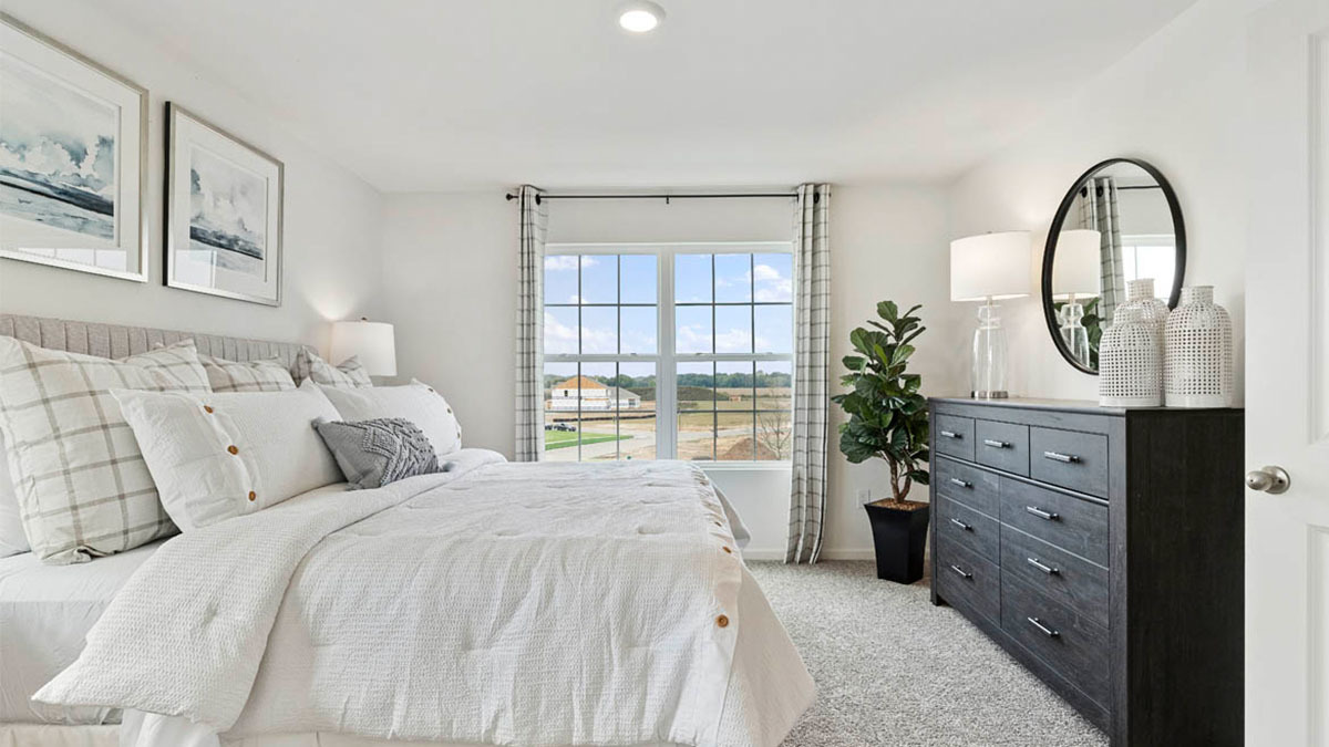 6520 Linden Trail, Unit B Wonder Lake, IL 60097 - Photo 20 of 37 a bedroom with a bed and a dresser