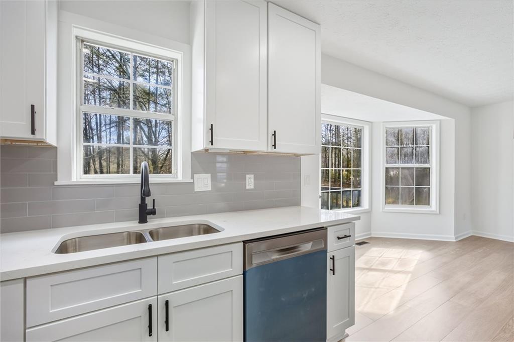 4457 Wesley Way Austell, GA 30106 - Photo 13 of 37 a kitchen with a sink and a window