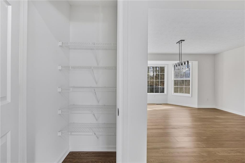 4457 Wesley Way Austell, GA 30106 - Photo 14 of 37 a view of a room with wooden floor and windows