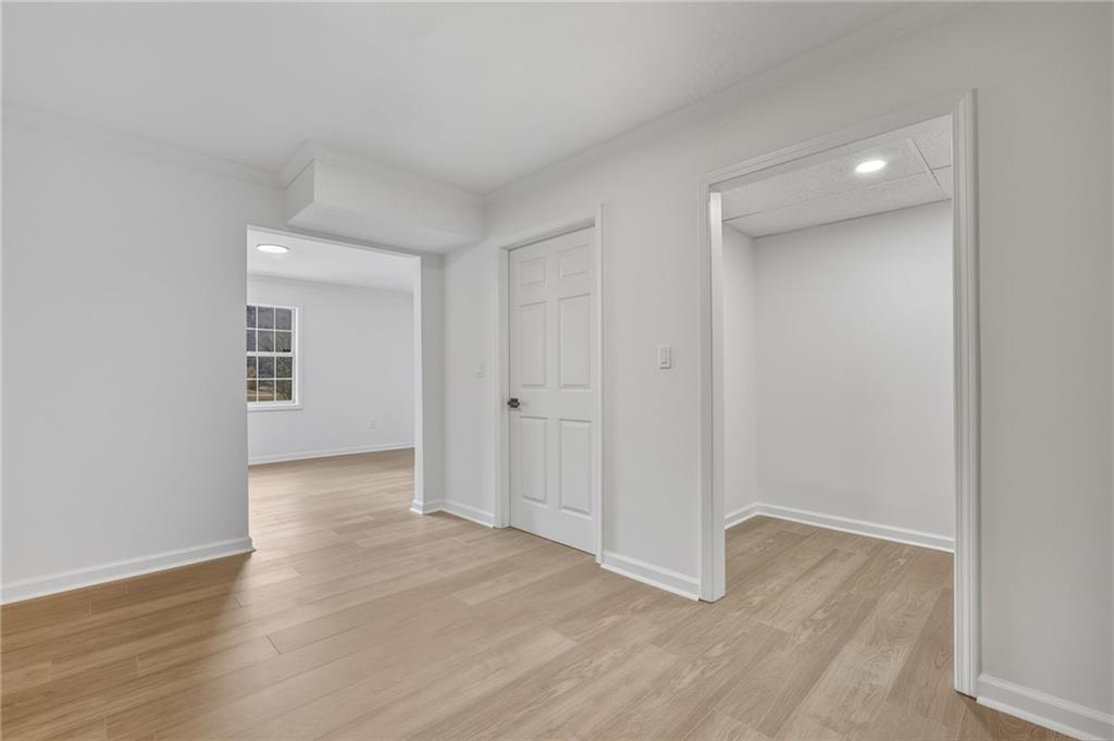 4457 Wesley Way Austell, GA 30106 - Photo 26 of 37 a view of an empty room with wooden floor and closet
