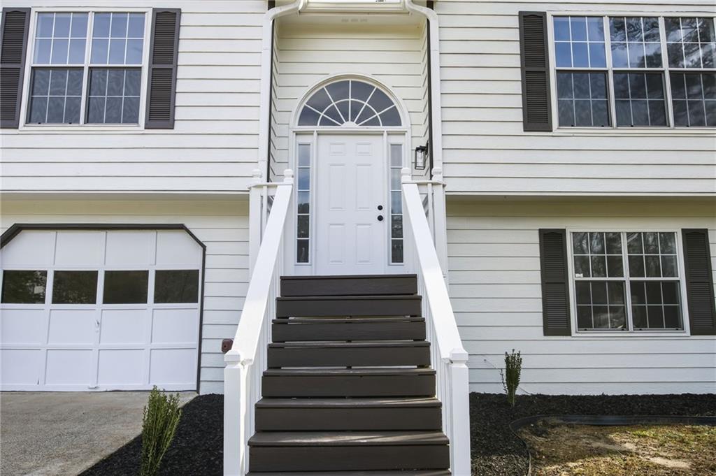 4457 Wesley Way Austell, GA 30106 - Photo 3 of 37 a view of a door of the house with a window