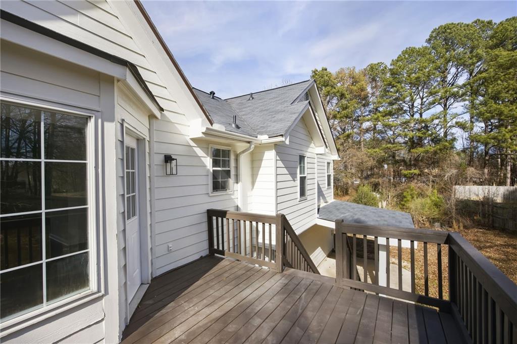 4457 Wesley Way Austell, GA 30106 - Photo 31 of 37 a view of a house with wooden deck