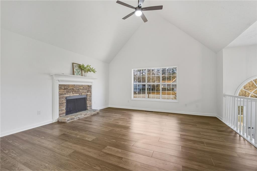4457 Wesley Way Austell, GA 30106 - Photo 6 of 37 a view of an empty room with a window and fireplace