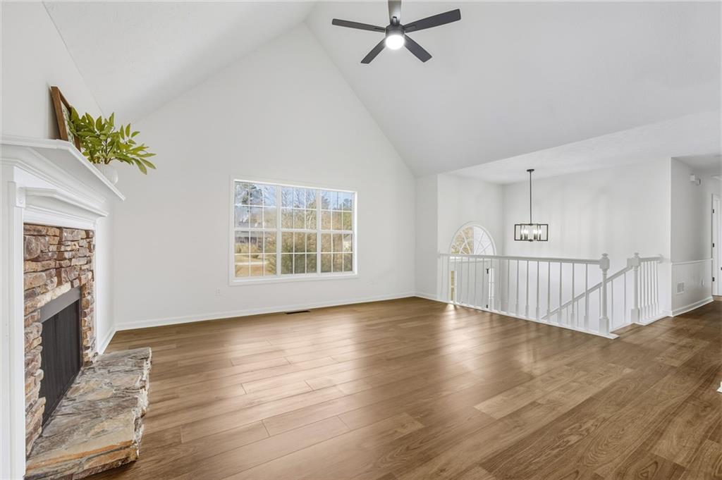 4457 Wesley Way Austell, GA 30106 - Photo 7 of 37 a view of an empty room with wooden floor and a window