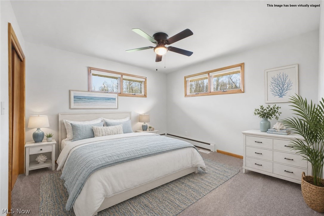 10121 Springfield Road Youngstown, OH 44514 - Photo 17 of 50 Bedroom 1 featuring light gray carpeting, crisp white walls, and a ceiling fan with integrated lighting
