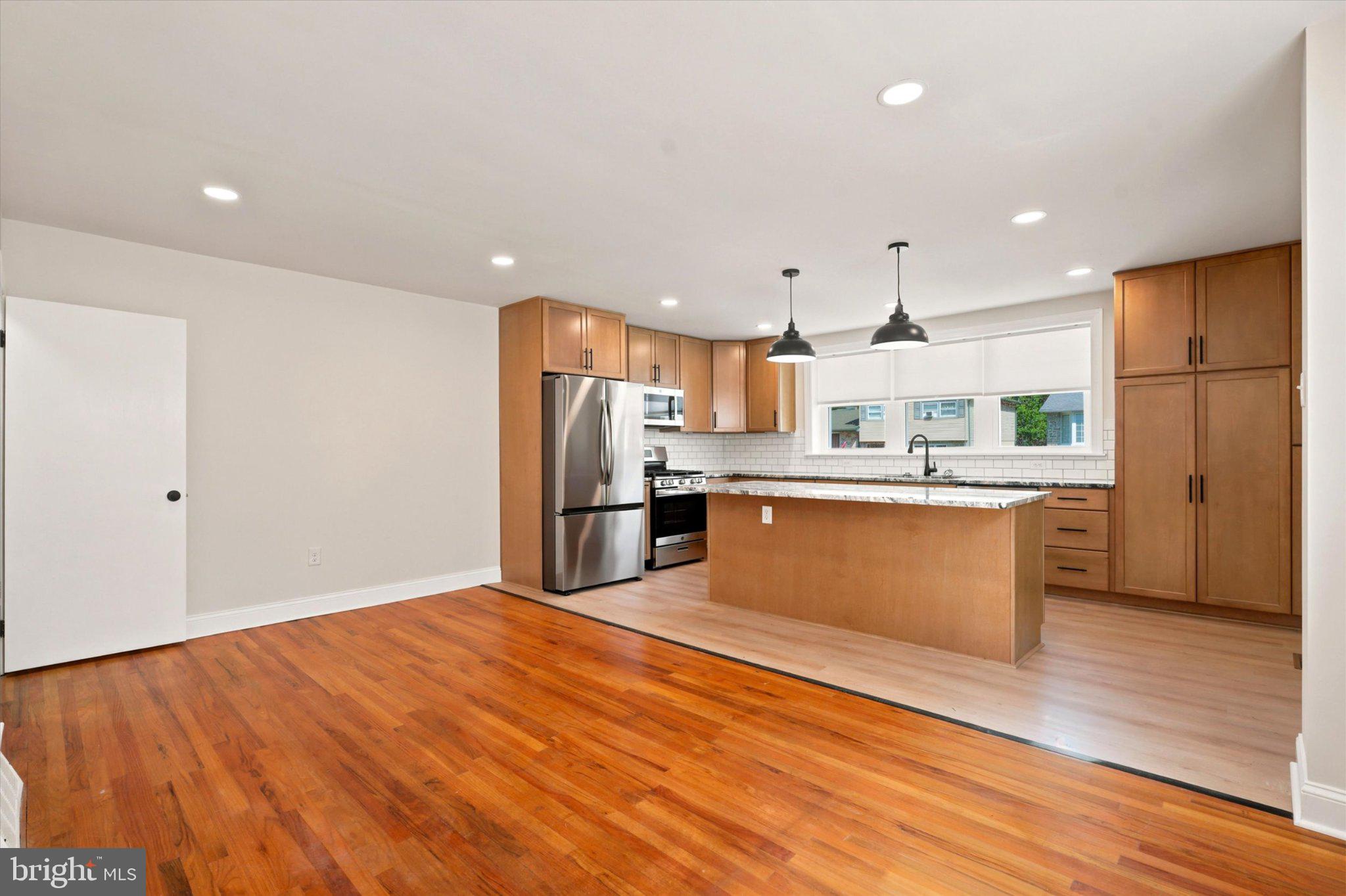 668 Renz Street Philadelphia, PA 19128 - Photo 6 of 25 Modern kitchen with warm wood accents.