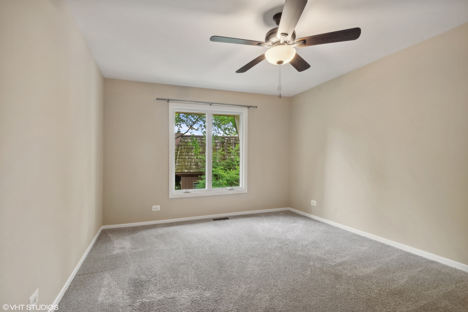 1649 Winnetka Road, Unit 1649 Glenview, IL 60025 - Photo 10 of 17 an empty room with a window and a fan