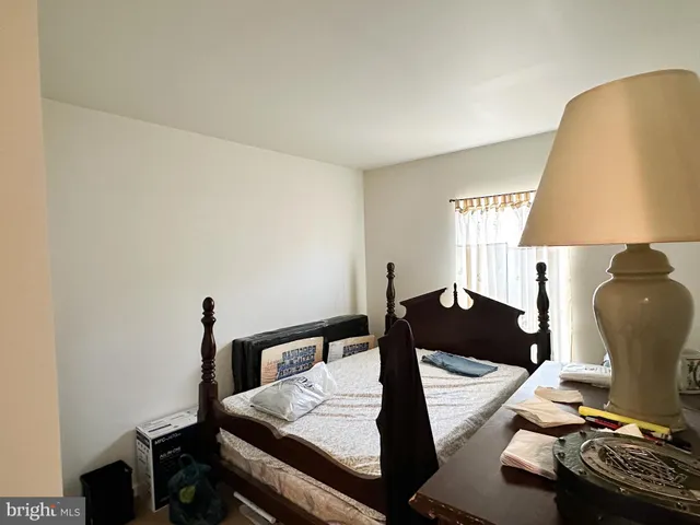 a living room with furniture and a lamp