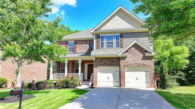 a front view of a house with garden