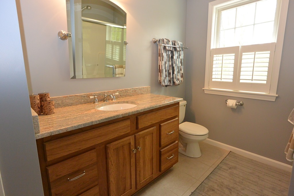4 Harding Lane Sturbridge, MA 01518 - Photo 14 of 23 a bathroom with a granite countertop toilet sink and mirror