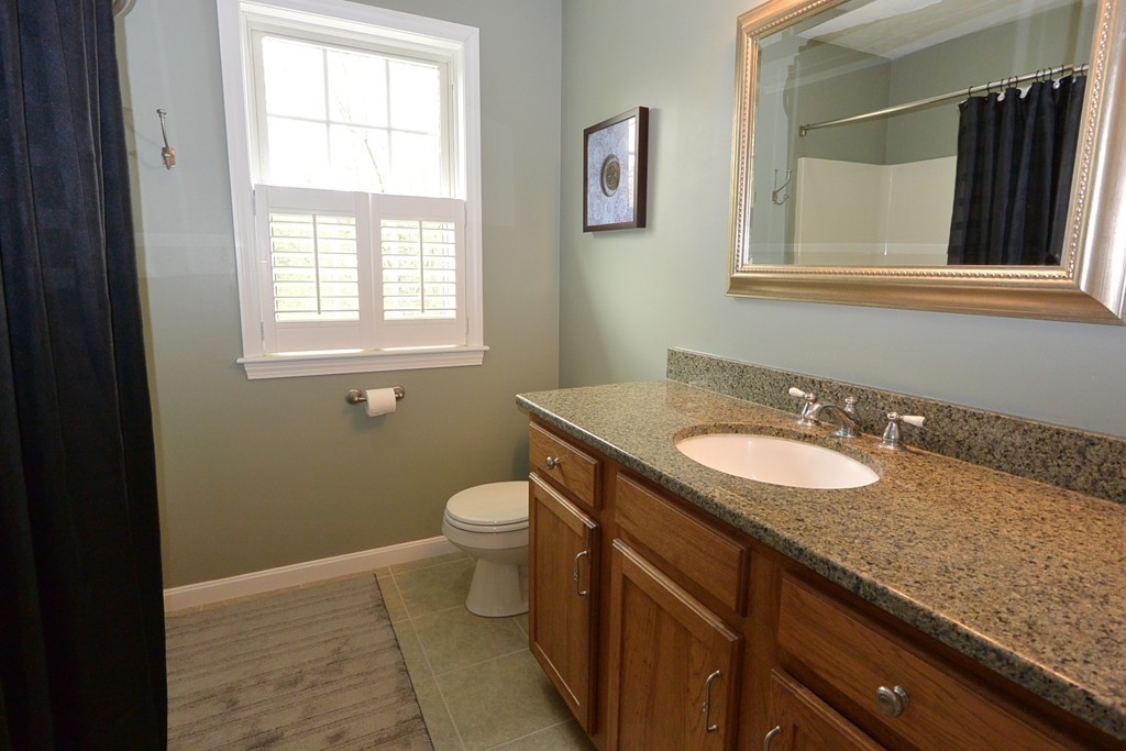 4 Harding Lane Sturbridge, MA 01518 - Photo 18 of 23 a bathroom with a granite countertop sink toilet and mirror