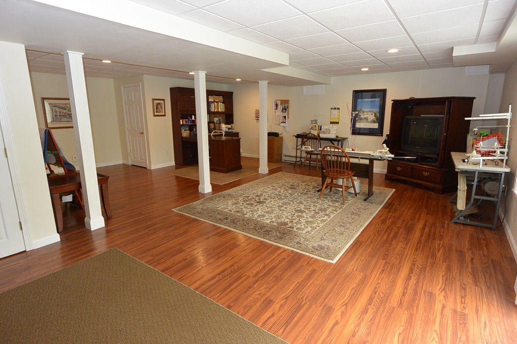 4 Harding Lane Sturbridge, MA 01518 - Photo 19 of 23 a living room with furniture and a flat screen tv