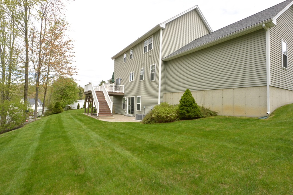4 Harding Lane Sturbridge, MA 01518 - Photo 22 of 23 a view of a backyard with plants and a patio