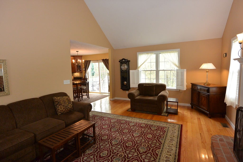 4 Harding Lane Sturbridge, MA 01518 - Photo 5 of 23 a living room with furniture and a fireplace