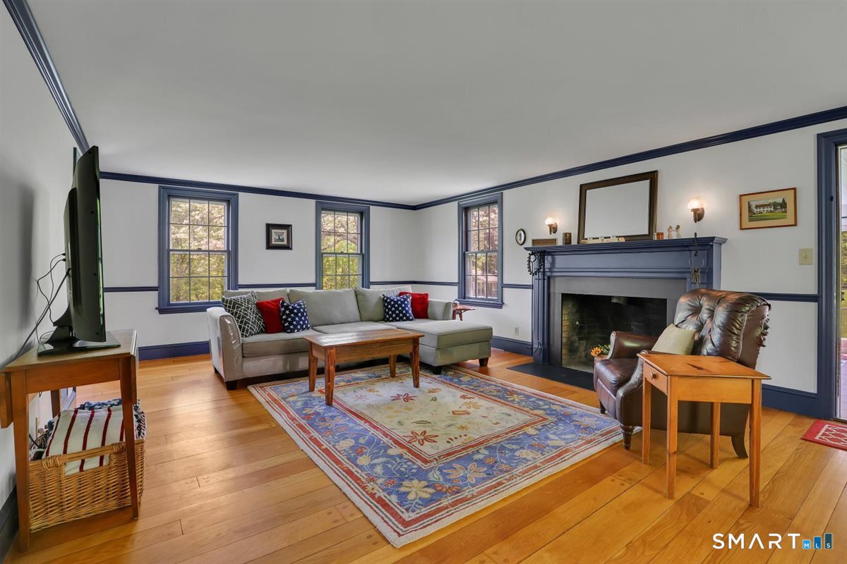 292 Parmelee Hill Road Durham, CT 06422 - Photo 16 of 39 The large scale of the living room offers flexible, and beautiful gathering space and features a fireplace and wide oak flooring
