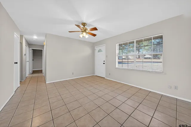 a living room with furniture potted plant and a window