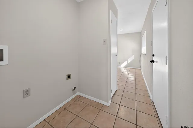 a bathroom with a granite countertop sink a toilet and mirror
