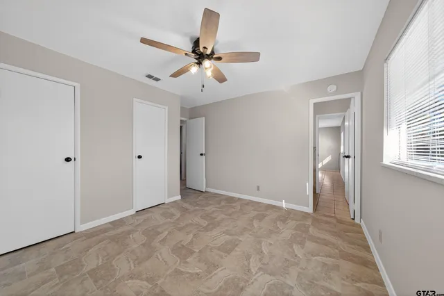 a view of storage and utility room with racks on the wall