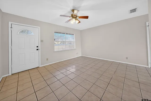 a view of an empty room and window