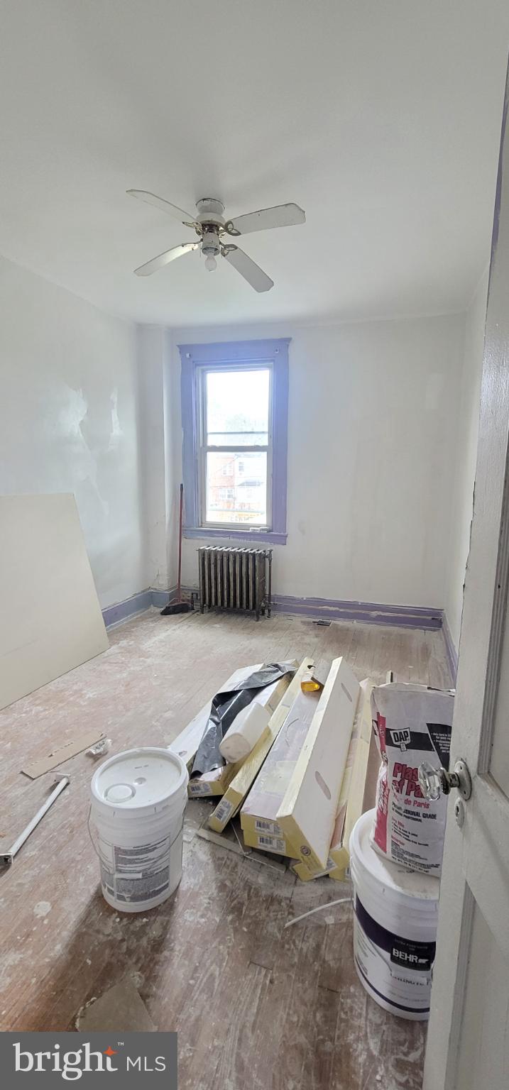 4041 Fairfax Road Baltimore, MD 21216 - Photo 6 of 10 a living room with hard wood flooring and a couch