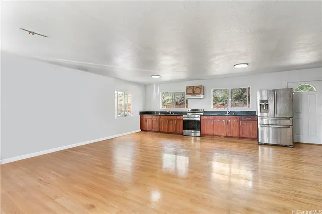 a view of a chairs and table in the patio