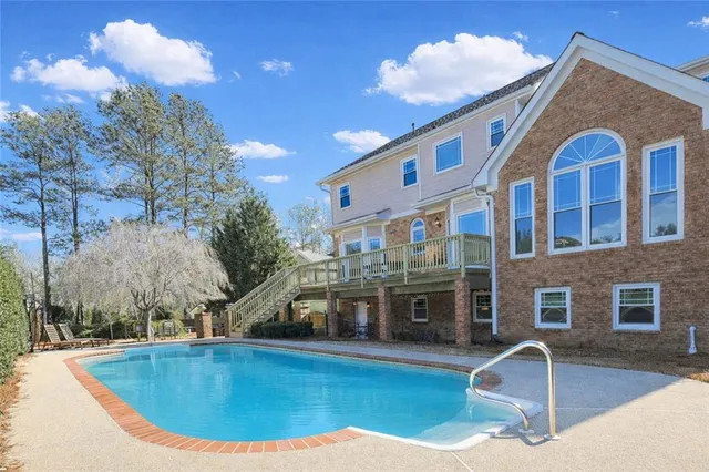 a view of a house with swimming pool