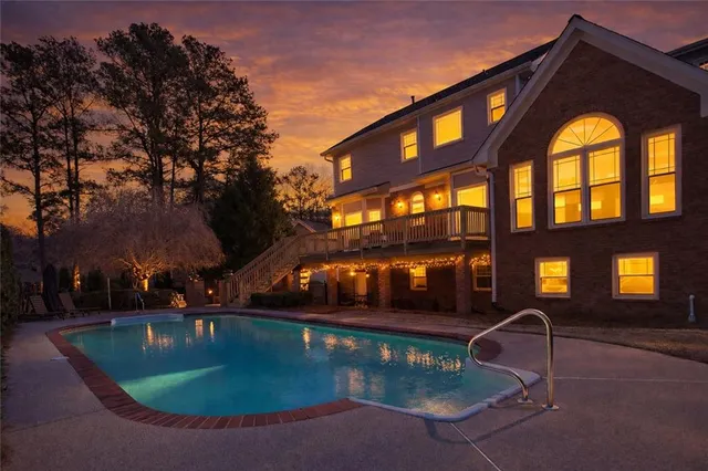 a view of a swimming pool with a yard