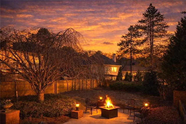 a view of a fountain in front of the house