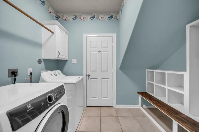 a view of storage and utility room with washer and dryer