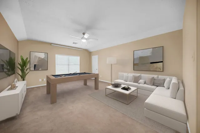 a living room with furniture and a large window