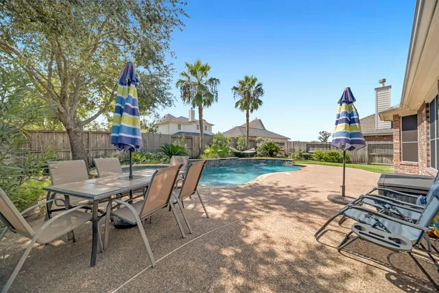 a view of a house with roof deck and sitting area
