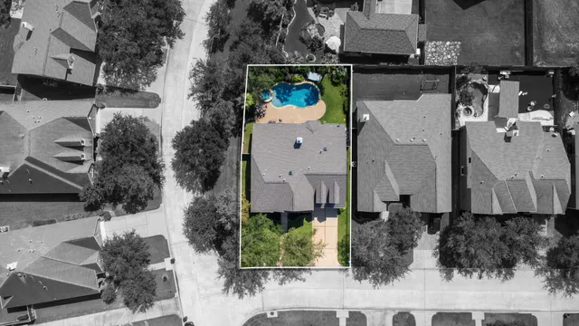 an aerial view of house with yard