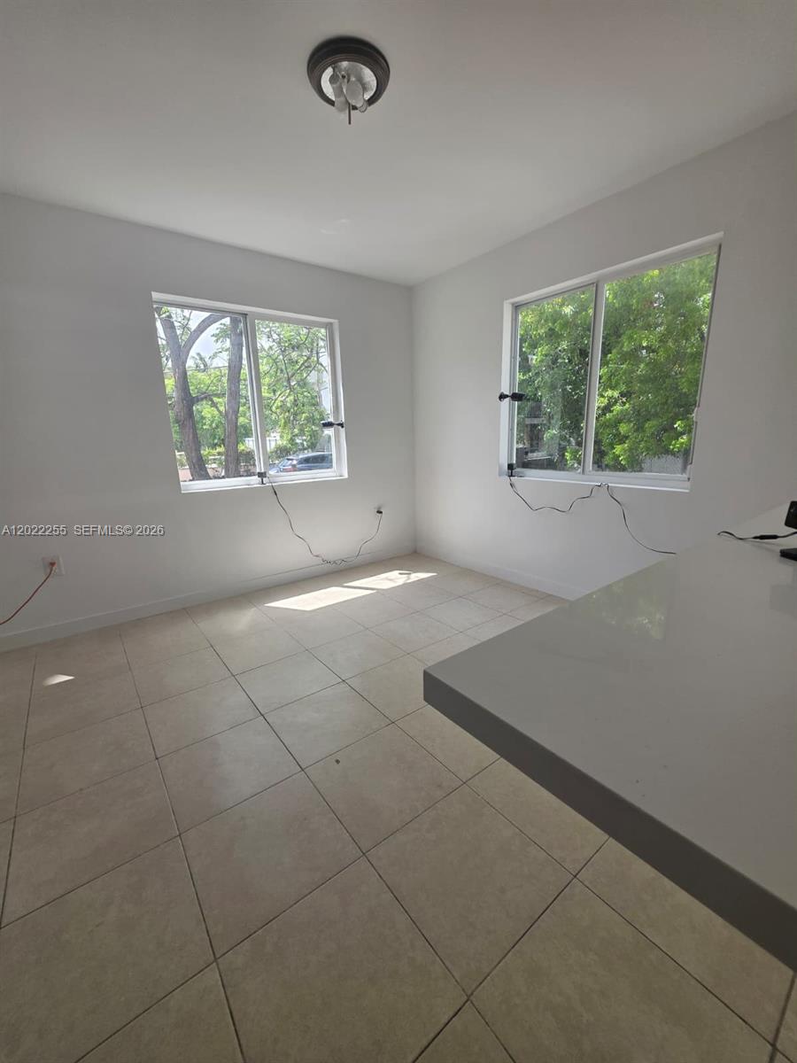 829 Southwest 3rd Street, Unit 831 Miami, FL 33130 - Photo 21 of 21 an empty room with a window