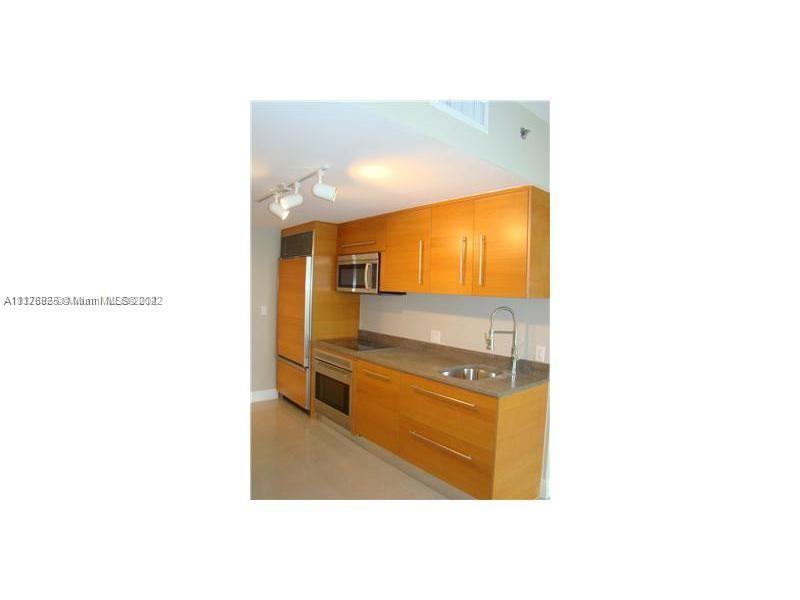 475 Brickell Avenue, Unit 808 Miami, FL 33131 - Photo 6 of 12 a bathroom with a sink and mirror