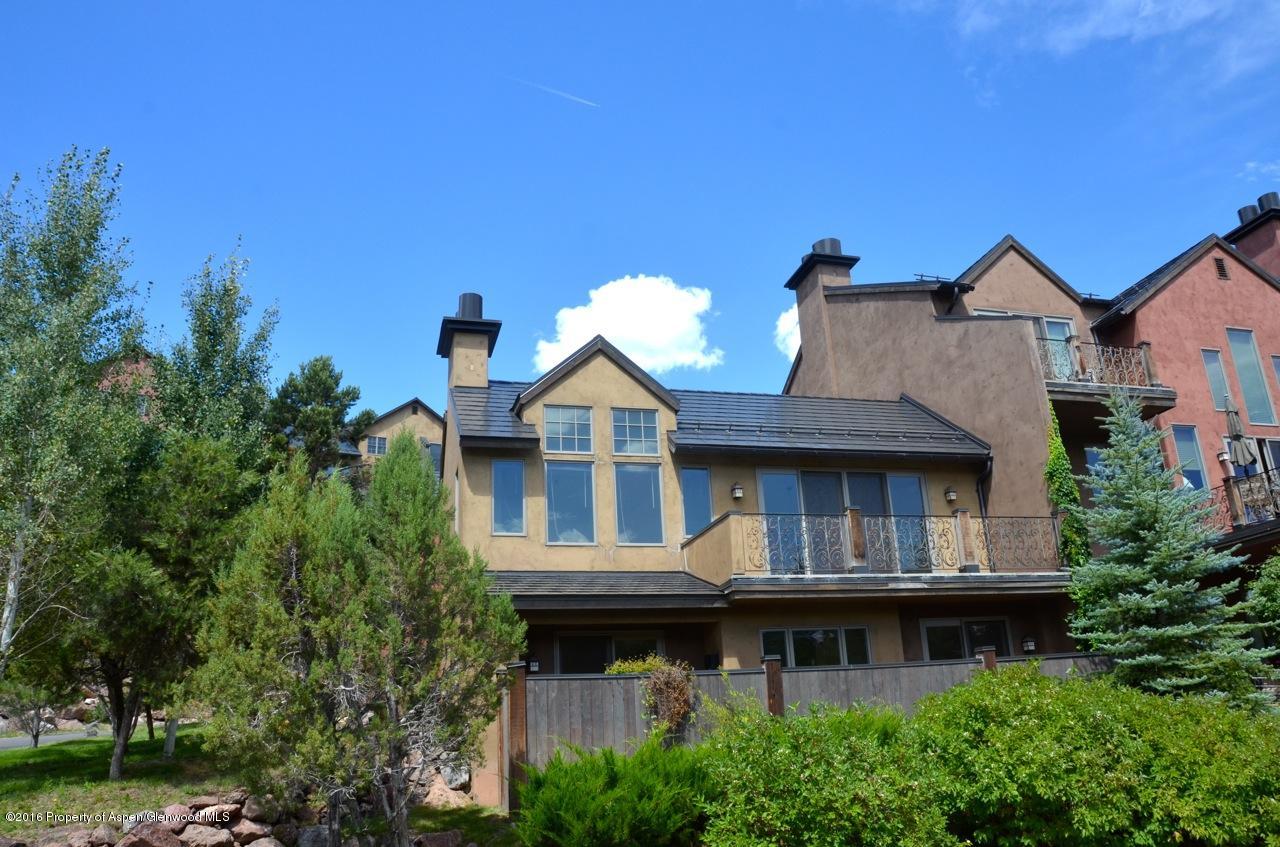 a view of house with roof deck and entertaining space