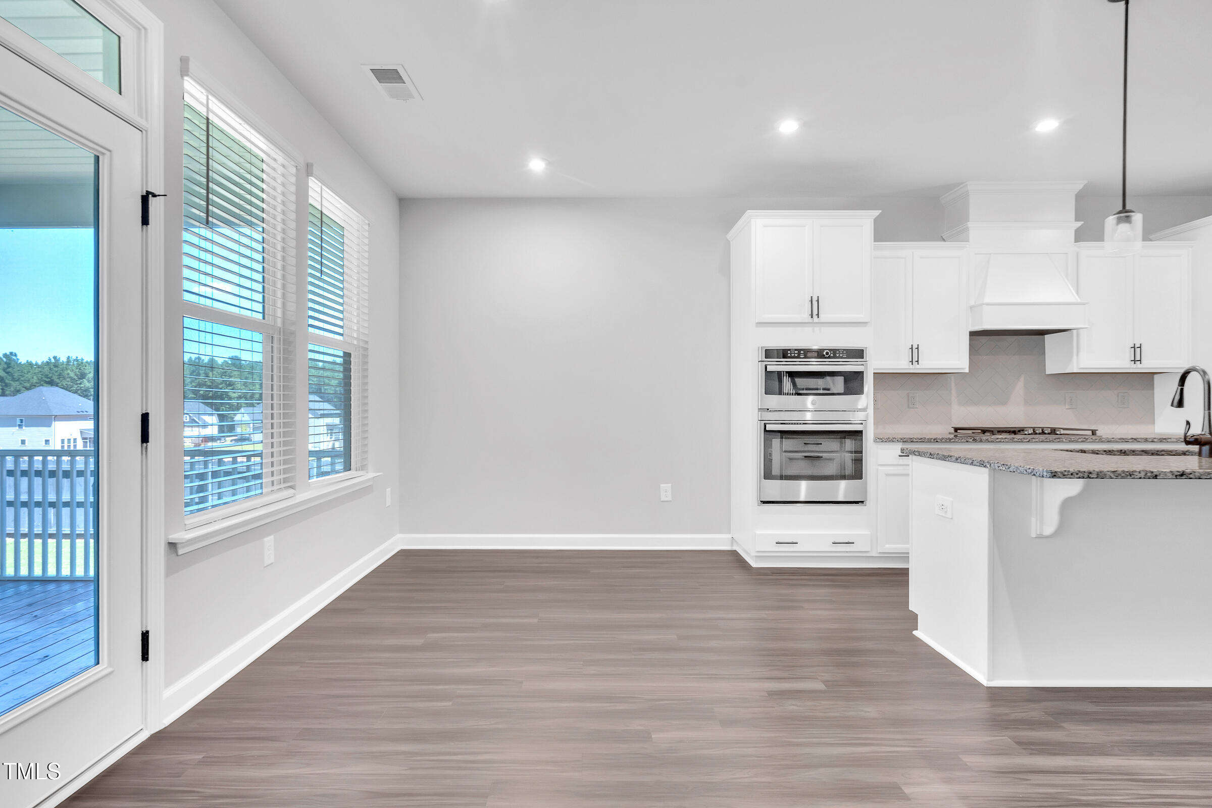 61 Cascade Place Clayton, NC 27527 - Photo 14 of 33 a kitchen with stainless steel appliances a refrigerator and a stove top oven