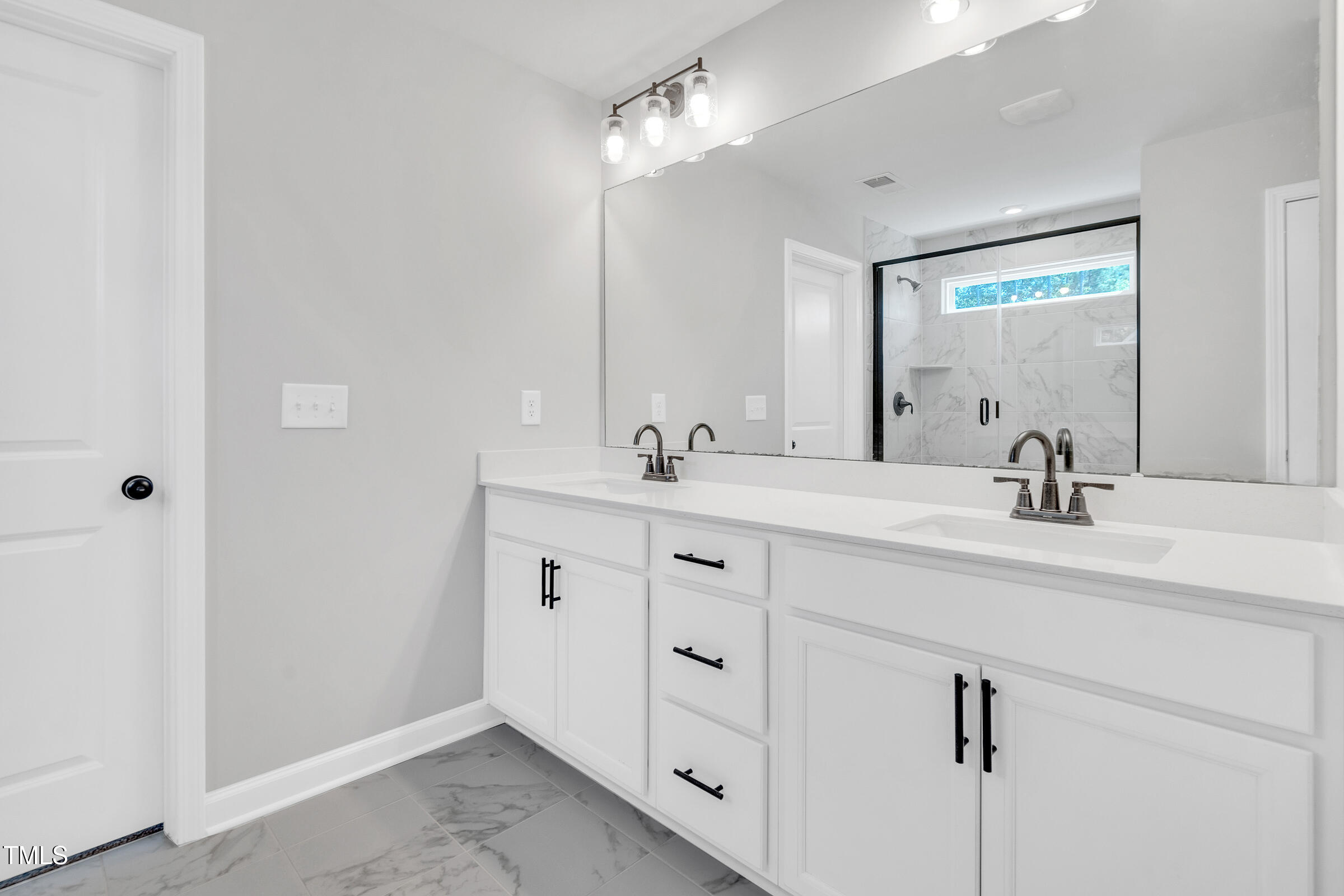 61 Cascade Place Clayton, NC 27527 - Photo 18 of 33 a bathroom with a double vanity sink mirror and