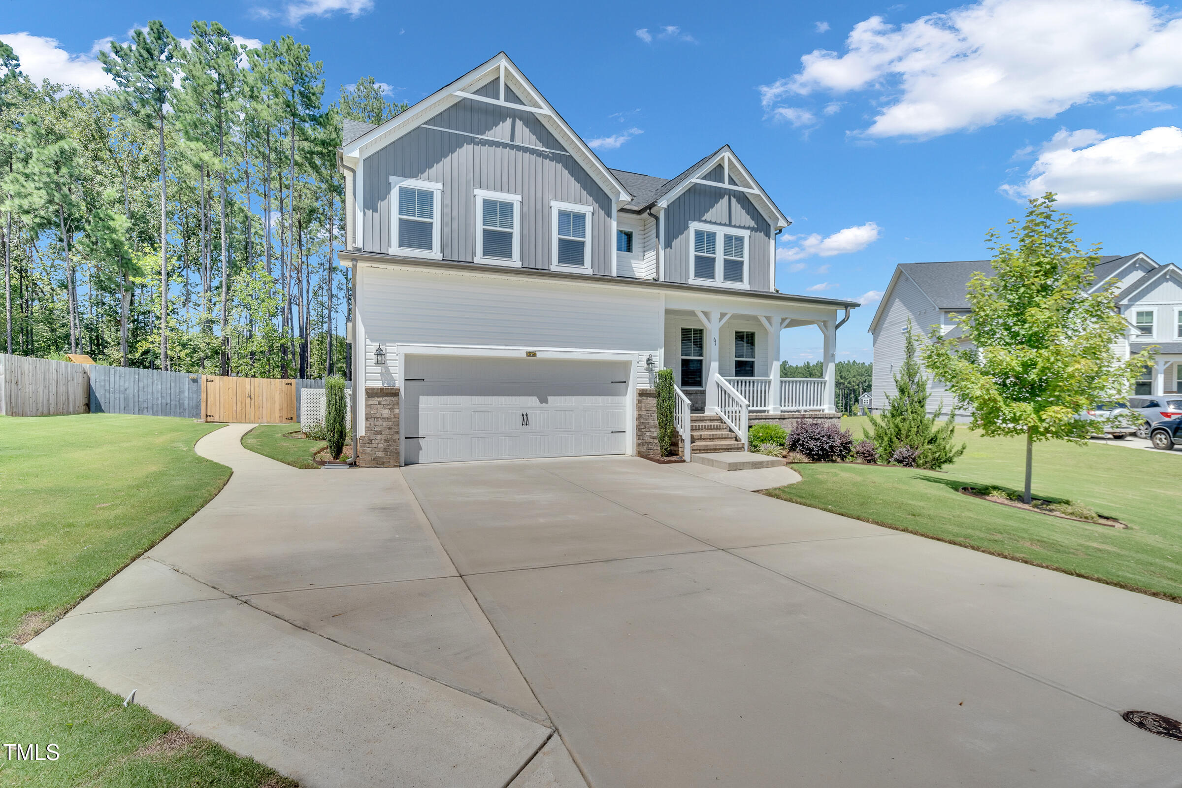 61 Cascade Place Clayton, NC 27527 - Photo 2 of 33 a front view of a house with a yard and garage