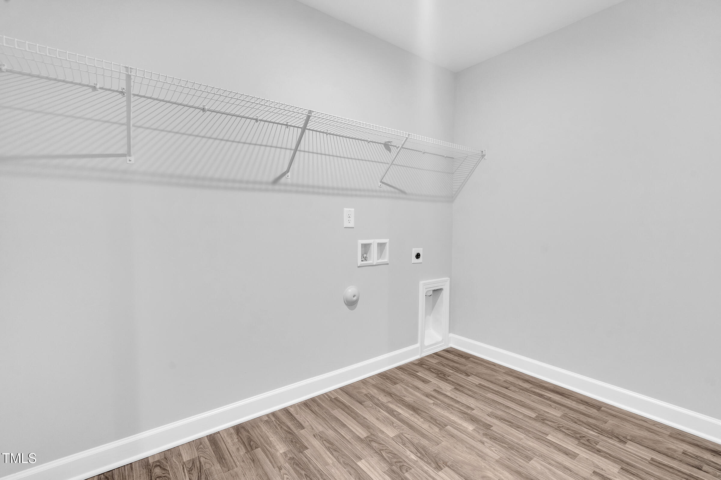 61 Cascade Place Clayton, NC 27527 - Photo 22 of 33 a view of a room with racks on the wall